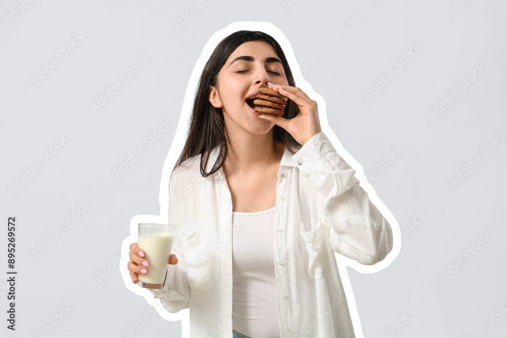 Beautiful young woman holding tasty cookies with chocolate chips and glass of milk on white background Beautiful young woman holding tasty cookies with chocolate chips and glass of milk on white background