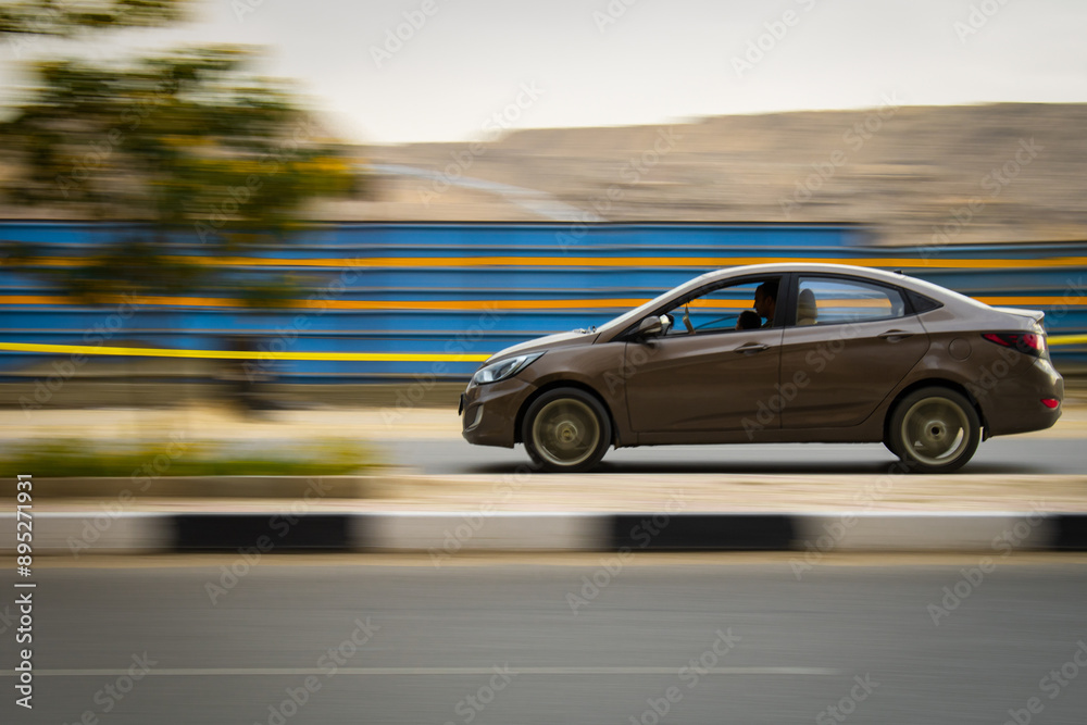 Panning Shot of a Car on the Road Panning Shot of a Car on the Road