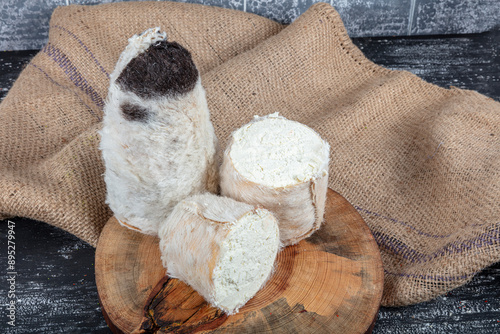 Goats Milk Cheese Tulum Cheese. Tulum cheese is a traditional Turkish goats milk cheese ripened in a goatskin casing. Local name obruk peyniri, Tulum peyniri. photo