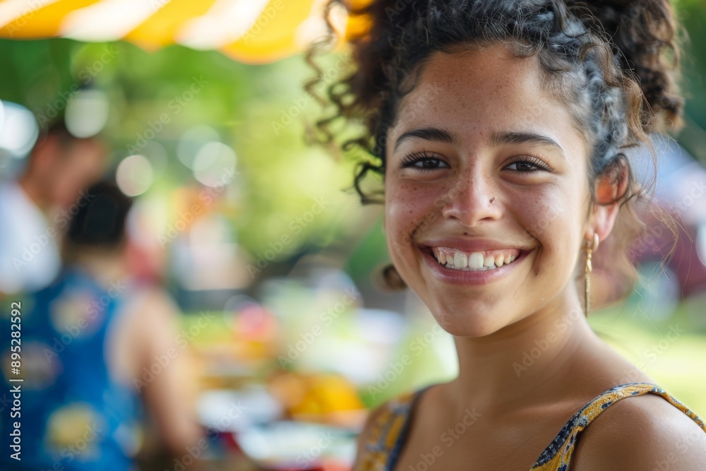 Portrait of a smiling young woman attending a barbecue Portrait of a smiling young woman attending a barbecue