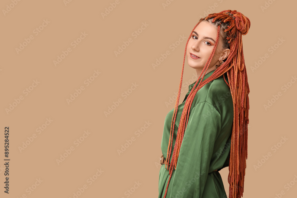Portrait of pretty young woman with dreadlocks on beige background Portrait of pretty young woman with dreadlocks on beige background