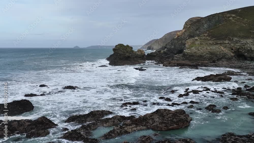 Waves at Storm in slow motion over rocks and cliffs from a drone, St. Agnes, Cornwall, England Waves at Storm in slow motion over rocks and cliffs from a drone, St. Agnes, Cornwall, England