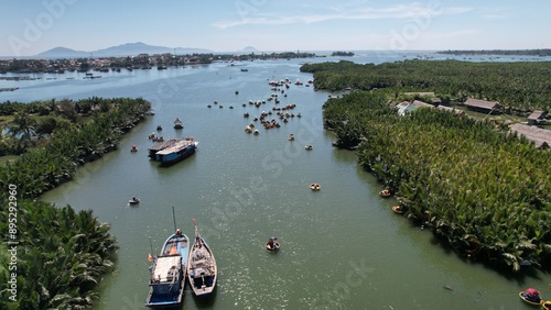 Drone view Basket Boat ridin in Hoi An, vietnam with the nature view of coconut forest  photo