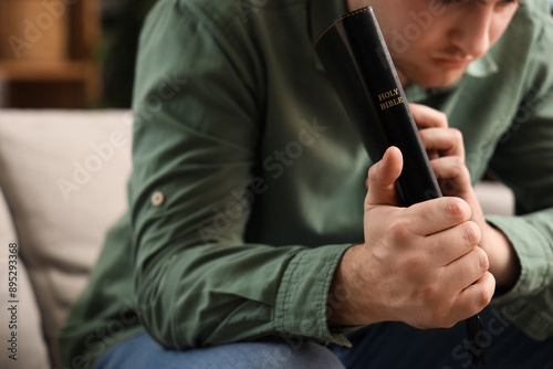 Young man with Holy Bible p...