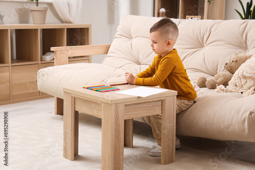 Cute little boy drawing wit...