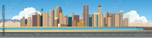 Horizontal view of Asphalt road.  Background of city skyline with skyscrapers. Road that cuts through skyscrapers with a river in between. Bridge across the river with light poles.