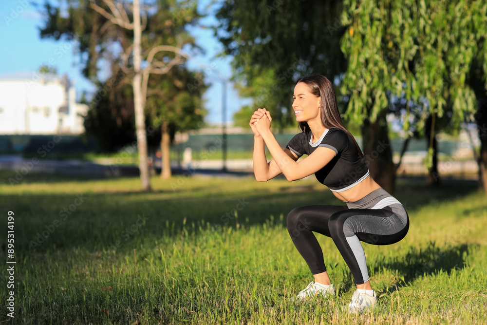 Sporty young woman exercising in park Sporty young woman exercising in park