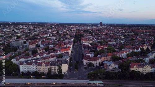 Berlin's Bundesplatz at sunset, showcasing the city's skyline with spectacular clouds. Dramatic aerial view flight descending drone photo