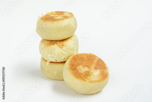 Bakpia is a food and souvenir typical of Yogyakarta made from a mixture of red beans or mung beans or cheese or yam coated with flour. That is an acculturation of Chinese culture. Isolated on white. photo