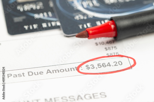 Overdue credit card bill with the due amount circled in red photo