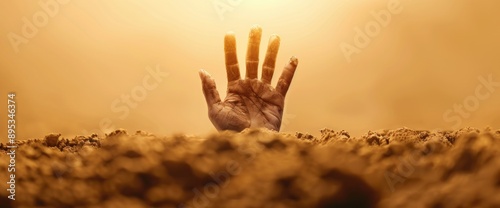 Zombie hand emerging from the ground with space for text