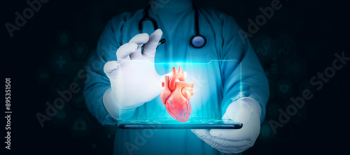 The doctor analyzes the human heart through a hologram projected from his tablet. Concept of modern technology in cardiology.