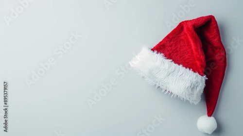 A red santa hat is on a white background