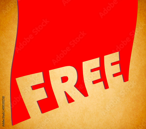 A banner with the word FREE is isaolated on a golden background in this 3-d illustration. photo