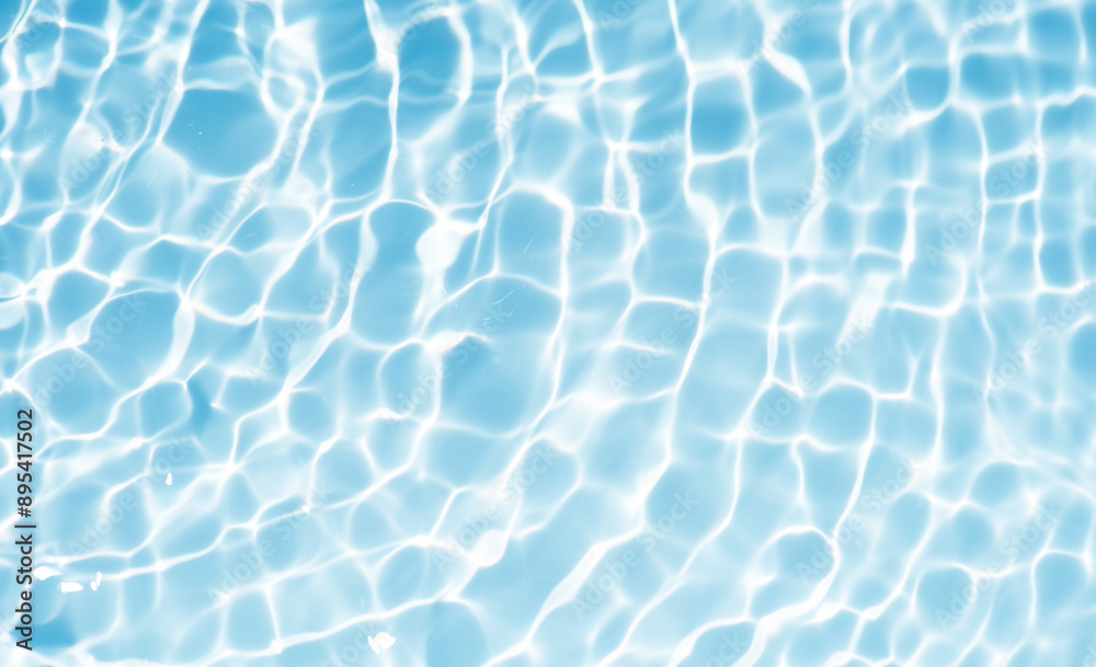 Blue water with ripples on the surface. Defocus blurred transparent blue colored clear calm water surface texture with splashes and bubbles. Water waves with shining pattern texture background. Blue water with ripples on the surface. Defocus blurred transparent blue colored clear calm water surface texture with splashes and bubbles. Water waves with shining pattern texture background.