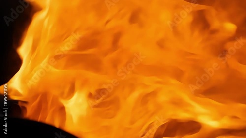 The fierce burn of a turbojet exhaust captured in slow motion as the bright orange flames twist and turn with incredible force.