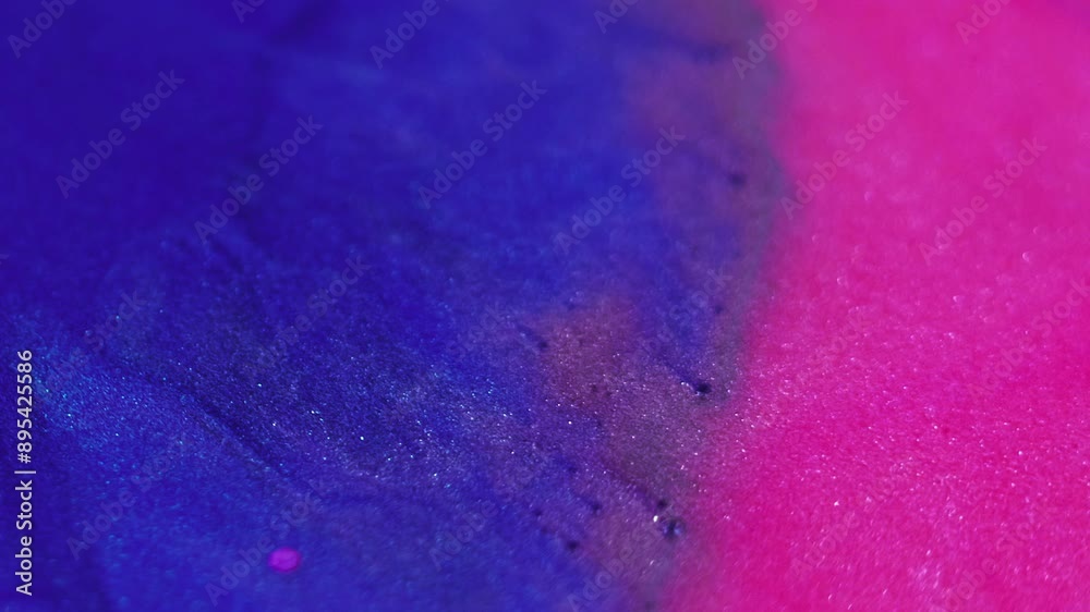 Wet paint. Sparkling liquid. Foam texture. Defocused blue pink color shiny particles glowing liquid brilliance cosmetic emulsion abstract art background. Wet paint. Sparkling liquid. Foam texture. Defocused blue pink color shiny particles glowing liquid brilliance cosmetic emulsion abstract art background.