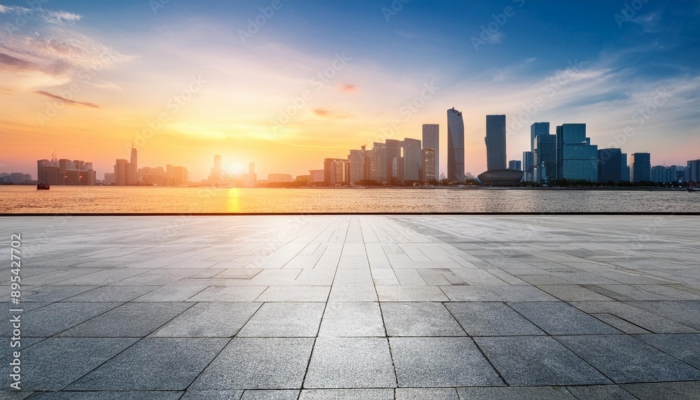 Stunning sunset view over a modern city skyline with calm waters and dramatic clouds, perfect for urban and nature themes. Stunning sunset view over a modern city skyline with calm waters and dramatic clouds, perfect for urban and nature themes.