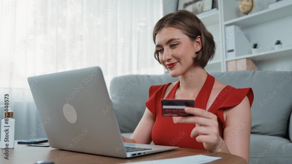 Woman shopping or pay online on internet marketplace browsing for sale items for modern lifestyle and use credit card for online payment from wallet protected by prim cyber security software Woman shopping or pay online on internet marketplace browsing for sale items for modern lifestyle and use credit card for online payment from wallet protected by prim cyber security software