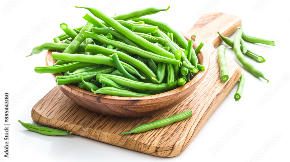 Green bean pieces filled in bowl placed on chopping board Green bean pieces filled in bowl placed on chopping board