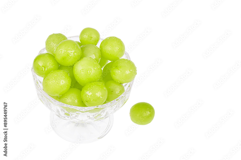 Fresh Shine Muscat grapes filled in a dessert bowl. white background - vitis vinifera 'shine muscat' Fresh Shine Muscat grapes filled in a dessert bowl. white background - vitis vinifera 'shine muscat'