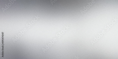 Abstract background with copy space created by light reflecting on a grainy metallic surface