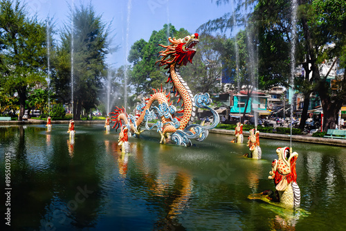 landscape of fountain with dragons in Thang Long park in China town of Ho Chi Minh City, Vietnam. It was built by the Chinese community during the French colonial period in Vietnam. photo