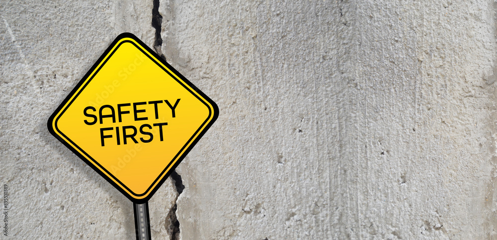 Yellow safety first sign.