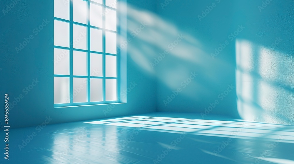 Sunlit empty blue room with geometric shadows cast by window Sunlit empty blue room with geometric shadows cast by window