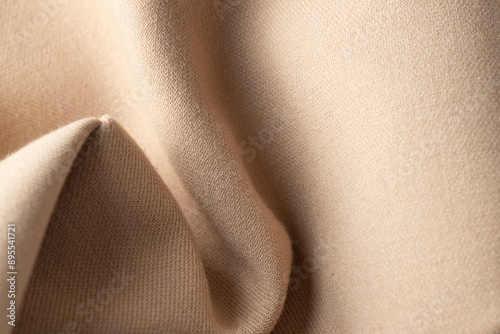 Fotografía Abstract knitted fabric in neutral beige colour, close up