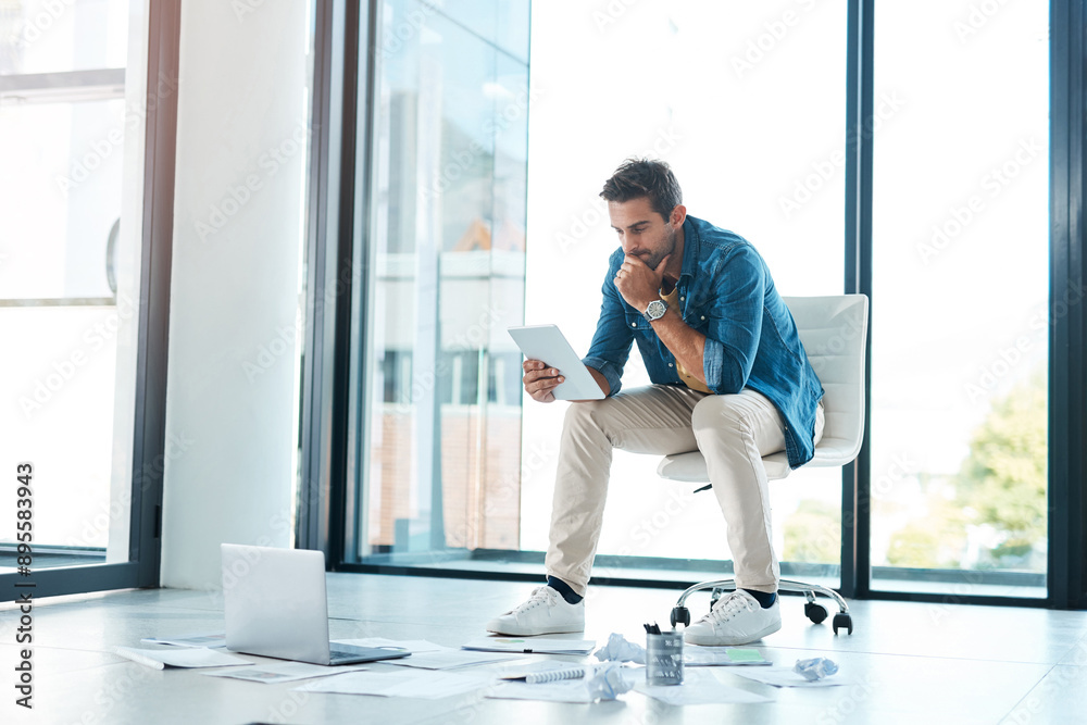 Tablet, thinking and business man reading email for brainstorming project ideas in startup. Technology, laptop and creative worker planning and problem solving for solution with paperwork on floor Tablet, thinking and business man reading email for brainstorming project ideas in startup. Technology, laptop and creative worker planning and problem solving for solution with paperwork on floor