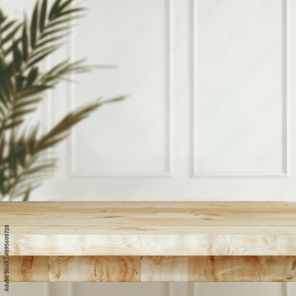 Empty wooden tabletop for product placement with white wall and tropical plant shadow Empty wooden tabletop for product placement with white wall and tropical plant shadow