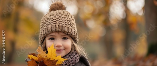 Girl Holding Autumn Leaves