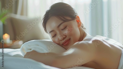 Free Download Relaxed Young Woman Enjoying Massage in Spa, Emphasizing Tranquility and Wellness, Perfect for Health and Beauty Themes - GFXLoad