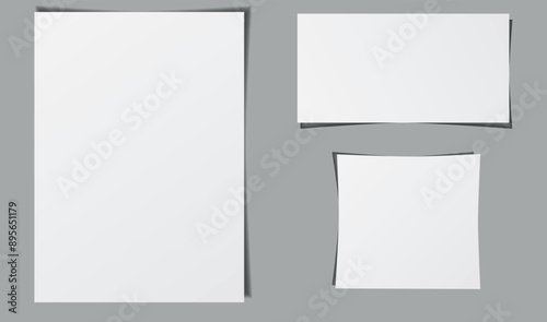 A blank page template. White blank pages of different sizes. Blank page with shadows. Blank sheets on grey.