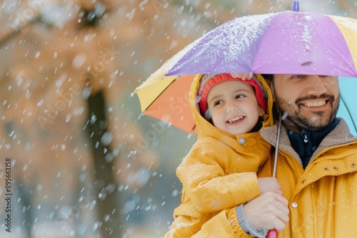 Father And Daughter Under Umbrella In Rain