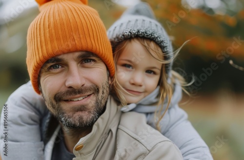 Father And Daughter Smiling In Autumn