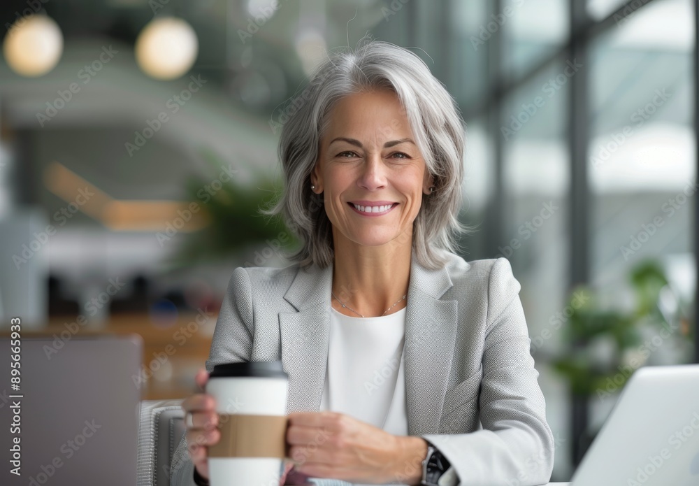 Woman Drinking Coffee at a Desk Woman Drinking Coffee at a Desk