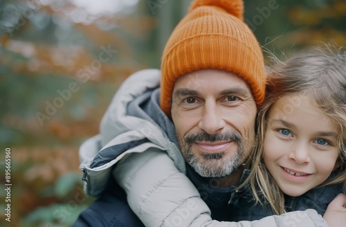 Father And Daughter Smiling In Autumn