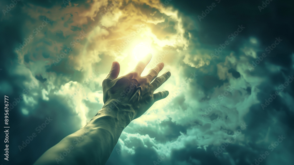 A hand reaching out from the darkness towards the heavenly light radiating through the clouds in the sky. A scene expressing hope for support and help.
