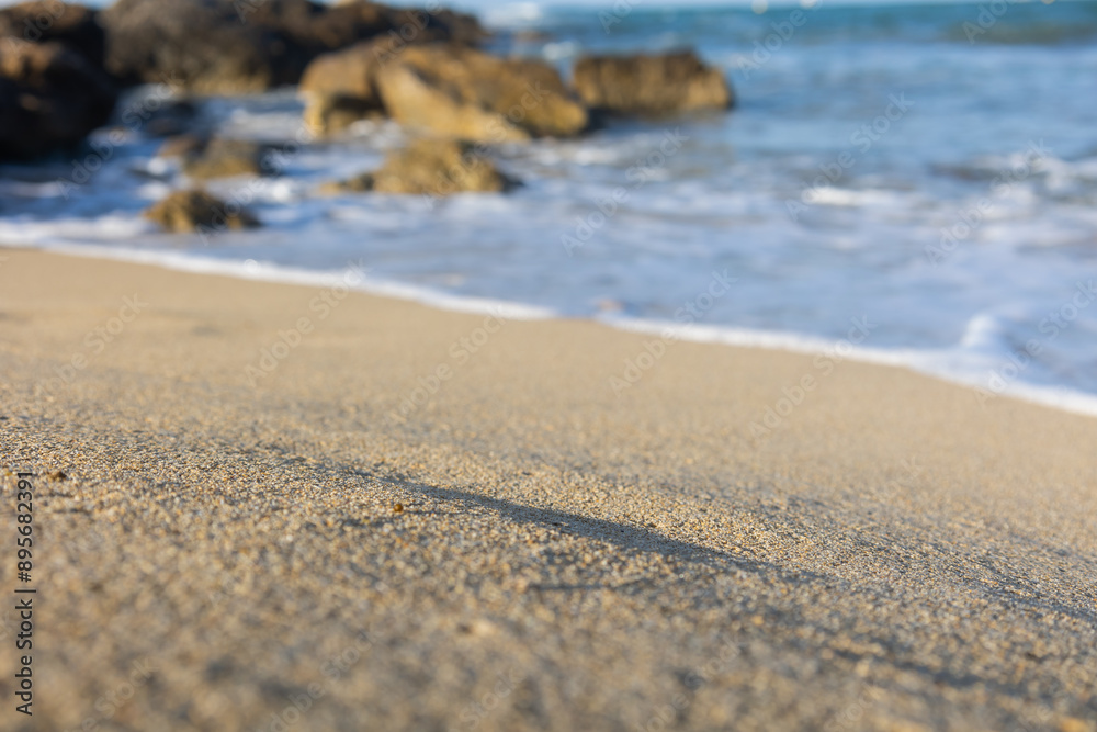 photo of the beach, with a splendid provocative white sand, the sea with a beautiful light blue and in the background a formation of rocks that give the beach a touch photo of the beach, with a splendid provocative white sand, the sea with a beautiful light blue and in the background a formation of rocks that give the beach a touch