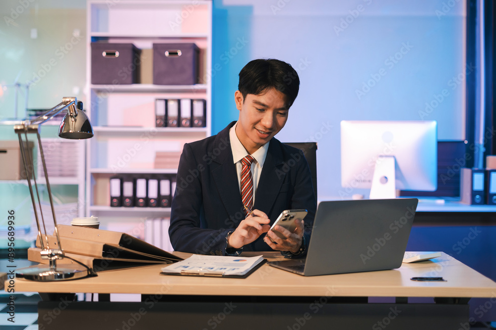 Business man working at office with laptop and documents on desk, financial adviser analyzing data, employees working overtime. Business man working at office with laptop and documents on desk, financial adviser analyzing data, employees working overtime.