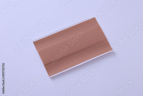 Single large bandage plaster on white background