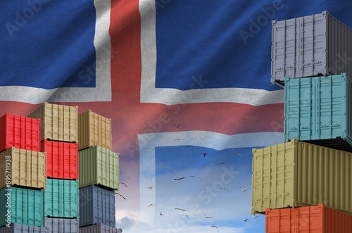 Iceland flag and big stack of shipping cargo containers in docks with sky background close up photo