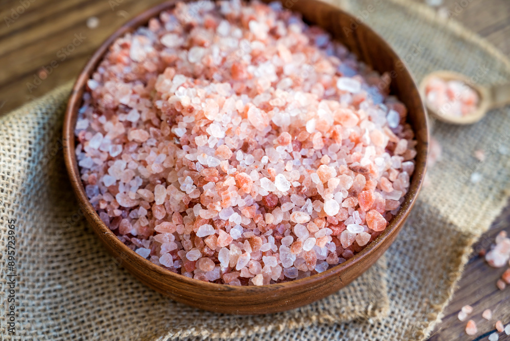 Pink Himalayan salt in wooden bowl Pink Himalayan salt in wooden bowl