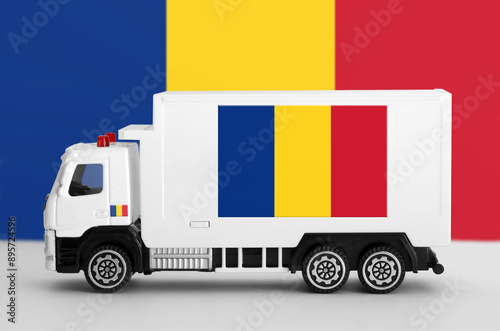 Romania flag depicted on side wall of white delivery van close up. Shipping and local delivery concept