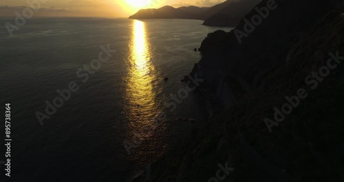 Pristine sunset landscape over the stunning coastline of Riomaggiore, Italy. photo