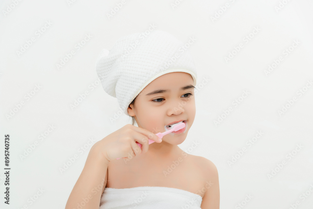 Smiling Child Brushing Teeth in Bathroom With Towel Wrap Smiling Child Brushing Teeth in Bathroom With Towel Wrap