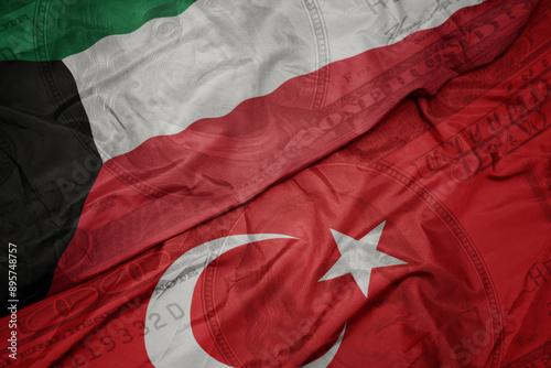 Fototapeta Naklejka Na Ścianę i Meble -  waving colorful flag of kuwait and national flag of turkey on the dollar money background. finance concept.