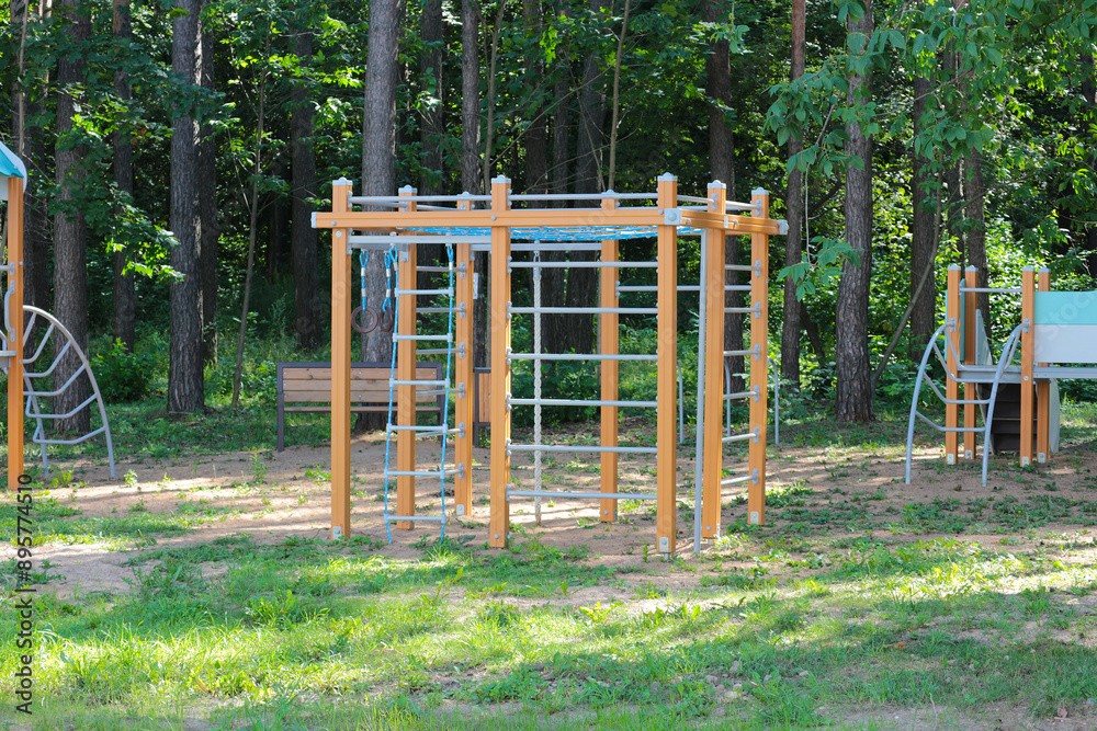 Sports ground with crossbars, stairs and horizontal bars in a forested area. Sports ground with crossbars, stairs and horizontal bars in a forested area.